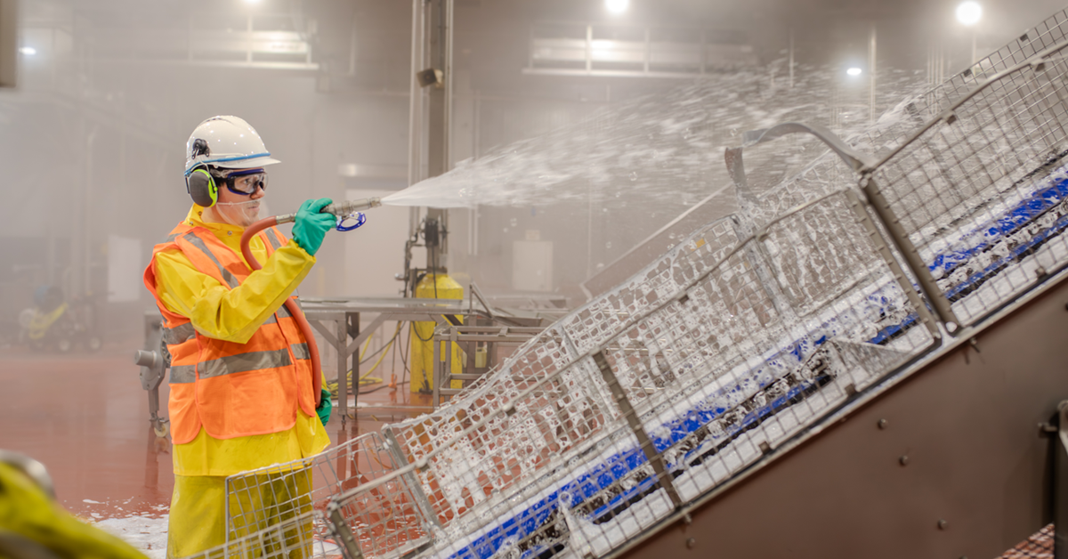 Sanitor Applying Cleaning Chemicals